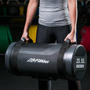 Individual deadlifting a black Life Fitness Core Bag in 25 kg/55 lbs.